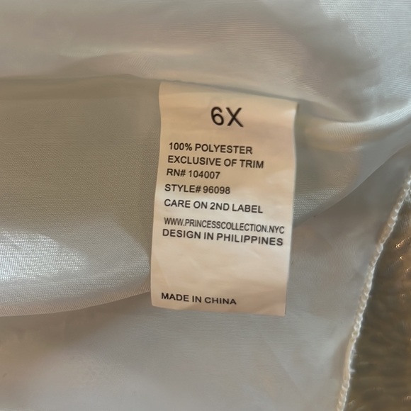 American Princess girls sleeveless dress with
pearl detail and tie in the back. - Picture 5 of 7